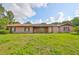Single story home with a brick exterior and a well-maintained lawn at 12922 672 Hwy, Riverview, FL 33579
