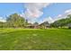 Single story home with a brick exterior and a well-maintained lawn and pool at 12922 672 Hwy, Riverview, FL 33579