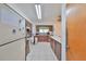 An efficient kitchen featuring tile floors and wood cabinets at 12922 672 Hwy, Riverview, FL 33579