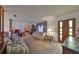 A comfortable living room featuring neutral carpet, sofas, and a natural light at 12922 672 Hwy, Riverview, FL 33579
