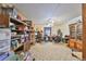 A spacious office space with carpet flooring, ceiling fan, and built-in shelving at 12922 672 Hwy, Riverview, FL 33579