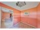 Empty pink room with a window AC unit and tiled floors at 12922 672 Hwy, Riverview, FL 33579