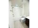 Bright bathroom featuring a bathtub with shower, toilet, and a vanity with modern fixtures at 11522 Cambium Crown Dr, Riverview, FL 33569