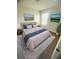 Cozy bedroom with a comfortable bed, soft linens, and natural light streaming through the window at 11522 Cambium Crown Dr, Riverview, FL 33569