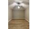 Bright, open bedroom with vaulted ceilings, ceiling fan, and modern wood-look floors at 13530 Oldenburg Dr, Hudson, FL 34667