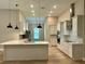 Bright kitchen with island, stainless steel appliances, and pendant lighting at 13530 Oldenburg Dr, Hudson, FL 34667