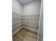 Walk-in pantry providing ample storage with metal shelving at 13530 Oldenburg Dr, Hudson, FL 34667