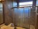 Bathroom featuring a glass door enclosed shower with tile walls at 614 Vintage Way, Brandon, FL 33511