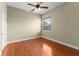 Bedroom with wood flooring, ceiling fan, and a window with blinds at 614 Vintage Way, Brandon, FL 33511