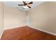 Bedroom with wood floors, ceiling fan, and a door at 614 Vintage Way, Brandon, FL 33511