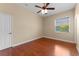 Bedroom featuring wood floors, ceiling fan, and a view from the window at 614 Vintage Way, Brandon, FL 33511