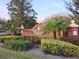 Community entrance with a brick sign and manicured landscaping at 614 Vintage Way, Brandon, FL 33511