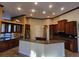 Spacious kitchen features granite countertops, stainless steel appliances and custom wood cabinetry at 614 Vintage Way, Brandon, FL 33511