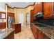 Kitchen with stainless steel appliances, granite countertops, and wood cabinets at 614 Vintage Way, Brandon, FL 33511