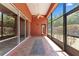 Covered outdoor lanai featuring tile flooring, ceiling fan, and access to backyard at 614 Vintage Way, Brandon, FL 33511