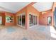 Expansive covered lanai with tile flooring, ceiling fan, and multiple entry points at 614 Vintage Way, Brandon, FL 33511