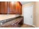 Office with granite countertops, cabinets, and a door to outside at 614 Vintage Way, Brandon, FL 33511