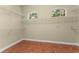 Walk-in closet with tile floors, two small windows and wire shelving at 614 Vintage Way, Brandon, FL 33511