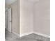Spacious bedroom with gray carpeting, neutral walls, and white baseboards at 11522 Cambium Crown Dr, Riverview, FL 33569