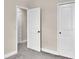 Bedroom with gray carpeting, white doors and neutral walls at 11522 Cambium Crown Dr, Riverview, FL 33569