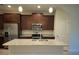 Modern kitchen with granite countertops, stainless steel appliances, and ample cabinet space at 11522 Cambium Crown Dr, Riverview, FL 33569