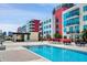 Community pool with surrounding patio furniture at 1120 E Kennedy Blvd # 827, Tampa, FL 33602