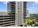 Exterior view of building with parking and green space at 1120 E Kennedy Blvd # 827, Tampa, FL 33602