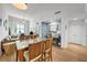 Open concept dining area with wood table and chairs and home office at 1120 E Kennedy Blvd # 827, Tampa, FL 33602