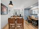 Open concept dining area with wood table and chairs, near living room at 1120 E Kennedy Blvd # 827, Tampa, FL 33602