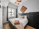 Spacious bedroom with a king-size bed and dresser at 1120 E Kennedy Blvd # 827, Tampa, FL 33602