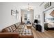 Spacious living room with brown leather sectional sofa at 1120 E Kennedy Blvd # 827, Tampa, FL 33602