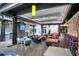 Outdoor patio area with seating, overhead cover, and ceiling fans at 1120 E Kennedy Blvd # 827, Tampa, FL 33602
