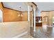 Open dining room with decorative columns and chandelier at 614 Vintage Way, Brandon, FL 33511