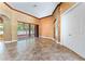 Spacious living room with tile floors and access to a screened patio at 614 Vintage Way, Brandon, FL 33511