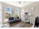 Home office with standing desk and large windows at 9107 Moonlit Meadows Loop, Riverview, FL 33578