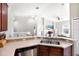 Modern kitchen features stainless steel appliances and ample counter space at 9107 Moonlit Meadows Loop, Riverview, FL 33578