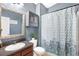 Updated bathroom with a shower and storage cabinet at 9107 Moonlit Meadows Loop, Riverview, FL 33578
