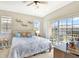 Spacious main bedroom with sliding glass doors to balcony at 9107 Moonlit Meadows Loop, Riverview, FL 33578