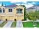 Two-story townhome with two-car garage and balcony at 9107 Moonlit Meadows Loop, Riverview, FL 33578
