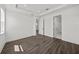 This spacious bedroom offers a tray ceiling, wood floors, and multiple entry points at 3778 Maxwell Park Dr, Sun City Center, FL 33573