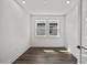 This bedroom features recessed lighting, two windows with views and wood-look flooring at 3778 Maxwell Park Dr, Sun City Center, FL 33573