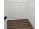 Walk-in closet with vinyl floors and wire shelving for storage at 3778 Maxwell Park Dr, Sun City Center, FL 33573