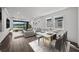 Open concept living and dining area featuring hardwood floors and views of the lake at 3778 Maxwell Park Dr, Sun City Center, FL 33573