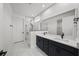 Elegant bathroom with double vanity, large shower, and modern fixtures at 3778 Maxwell Park Dr, Sun City Center, FL 33573