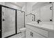 Clean bathroom with a walk-in shower and modern vanity at 3778 Maxwell Park Dr, Sun City Center, FL 33573