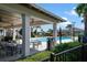 Community pool and patio with tables and seating at 3778 Maxwell Park Dr, Sun City Center, FL 33573