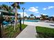 Resort-style pool with lounge chairs and shade umbrellas at 3778 Maxwell Park Dr, Sun City Center, FL 33573