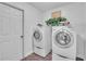 Bright laundry room with washer, dryer, and shelving at 12711 Royal George Ave, Odessa, FL 33556