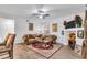 Living room features a cozy seating area and fireplace at 12711 Royal George Ave, Odessa, FL 33556