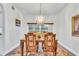 Elegant dining room with hardwood floors and a chandelier at 12711 Royal George Ave, Odessa, FL 33556